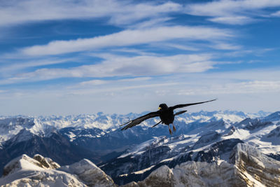 Man on mountain against sky