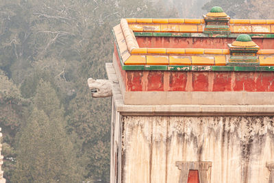 Edge of ancient chinese palace building. coloured tiles.