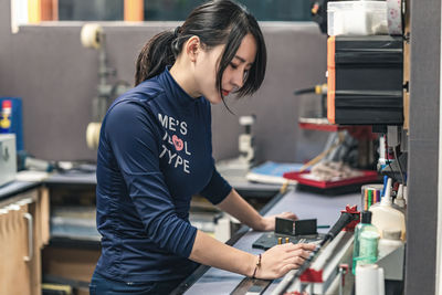 Side view of a woman working