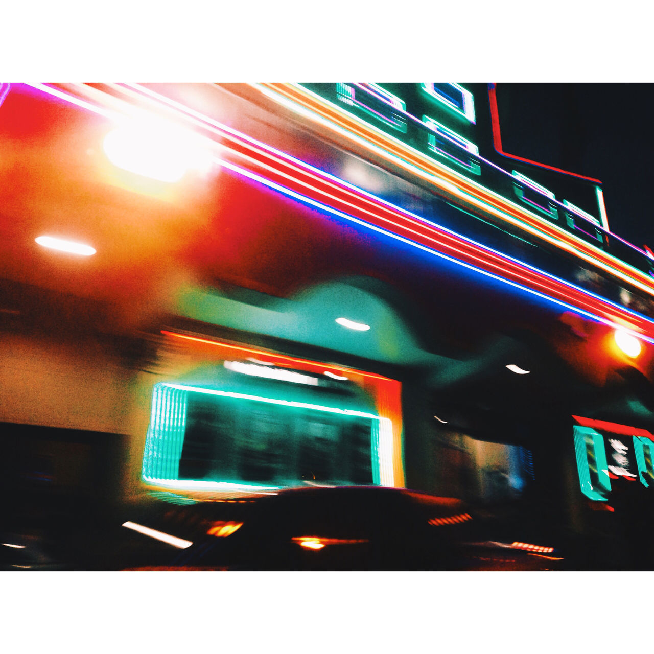 illuminated, night, transportation, architecture, built structure, lighting equipment, building exterior, city, light - natural phenomenon, mode of transport, street, land vehicle, street light, blurred motion, road, light trail, no people, car, lens flare, long exposure