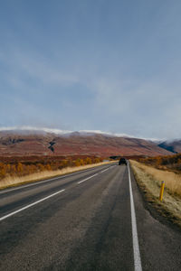 Empty road against sky