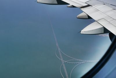 Close-up of aircraft wing in sky