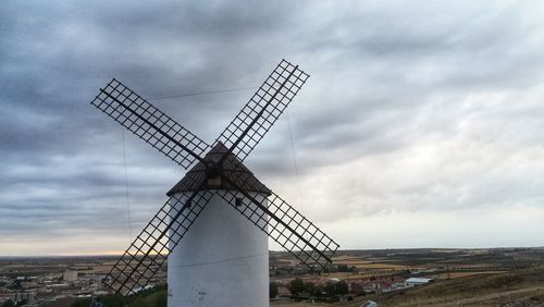 Traditional windmill against sky