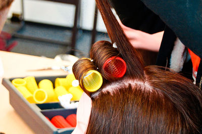 Close-up of woman hair with curlers