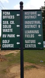 Information sign against sky