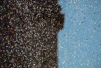 Full frame shot of raindrops on window