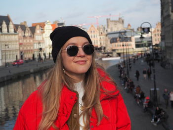 Portrait of smiling woman in city