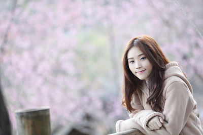 Portrait of smiling young woman outdoors