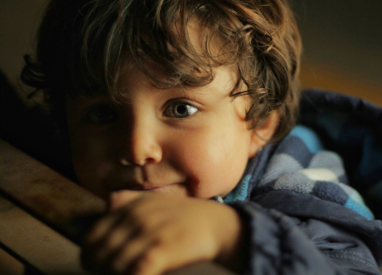 CLOSE-UP PORTRAIT OF CUTE BOY WITH EYES CLOSED