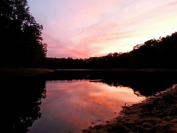 Scenic view of calm lake at sunset