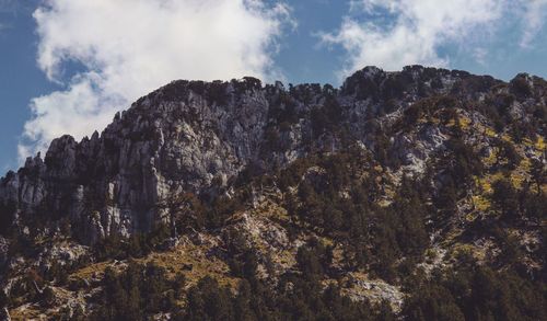 Low angle view of rock formation against sky