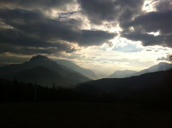 Scenic view of silhouette mountains against sky during sunset