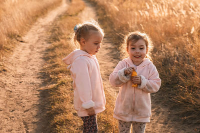 Sibling rivalry erupts, sisters duel over sudsy showdown in autumn. sisterly  dirty in autumn