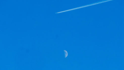Scenic view of moon against blue sky