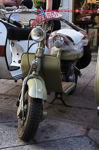 Motorcycle parked on street in city