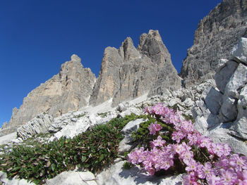 Scenic view of rocky mountains against clear blue sky