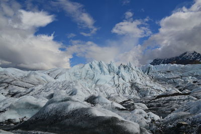 Scenic view of snowcapped landscape against sky