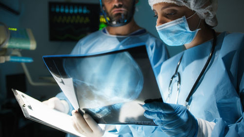 Medical team examine x-ray in surgery room