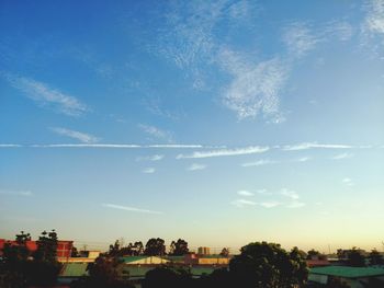 View of cityscape against blue sky