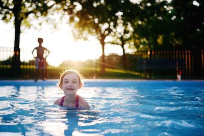 Portrait of smiling girl in swimming pool