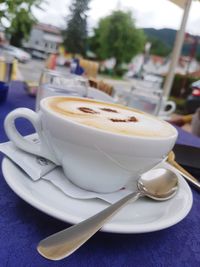 Close-up of coffee cup on table