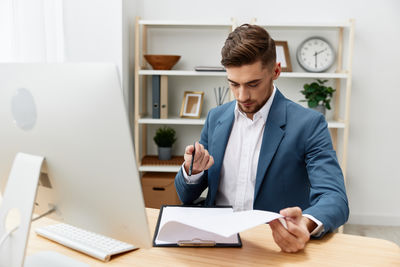 Businesswoman working at desk in office