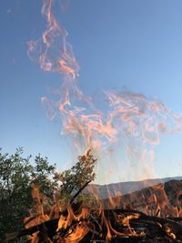 Scenic view of bonfire against clear sky