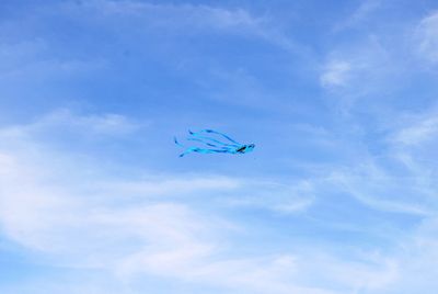 Low angle view of kite flying in sky