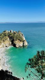 Scenic view of sea against clear blue sky