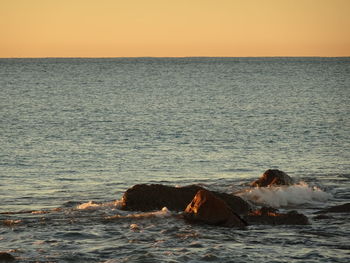 Scenic view of sea against clear sky