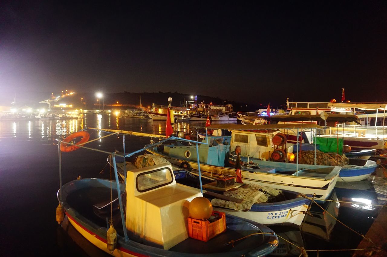 nautical vessel, boat, moored, night, illuminated, transportation, harbor, outdoors, mode of transport, building exterior, no people, built structure, architecture, water, sea, clear sky, sky, nature, city