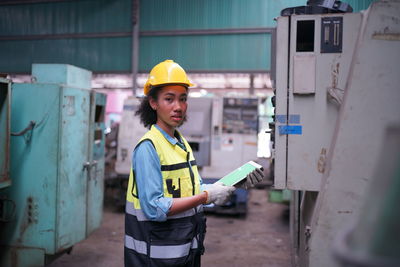 Portrait of engineer working at construction site