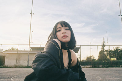 Portrait of woman against sky