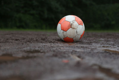 Close-up of soccer ball on field
