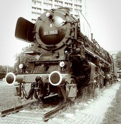 Train on railroad track against sky