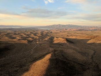 Scenic view of landscape against sky during sunset