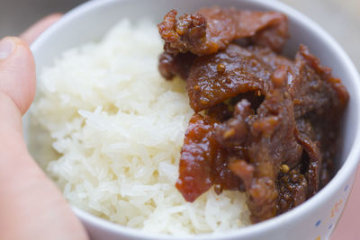 Close-up of person hand in bowl