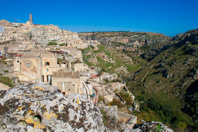 Panoramic shot of townscape against clear blue sky