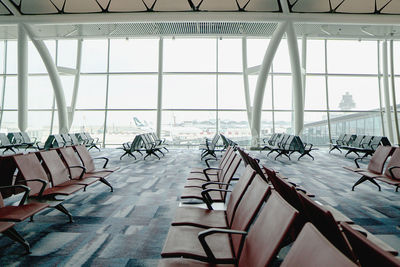 Empty chairs and tables at airport