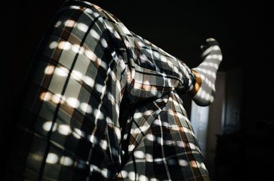 Low angle view of glass against black background