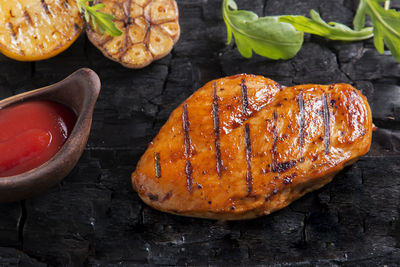 High angle view of meat on barbecue grill