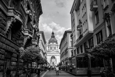 People on street against st stephen basilica amidst buildings in city