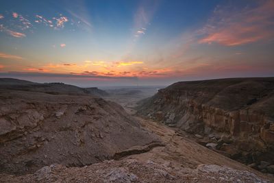 Scenic view of landscape against sky during sunset