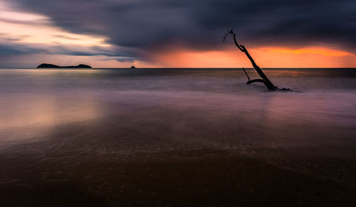 Scenic view of sea against sky at sunset