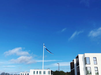 Low angle view of building against blue sky