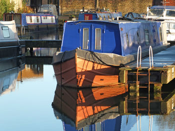 Old narrow boats converted to houseboats moored in the marina at brighouse basin in west yorkshire