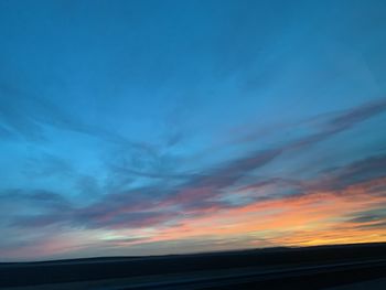 Scenic view of dramatic sky during sunset