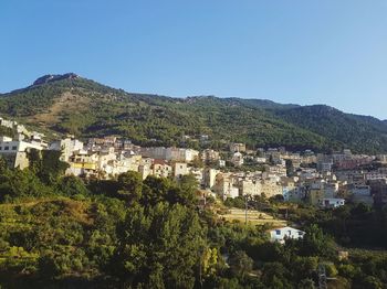 High angle view of town against clear sky