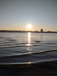 Scenic view of sea against clear sky during sunset