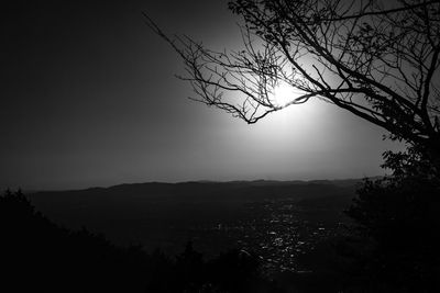 Silhouette tree on mountain against sky